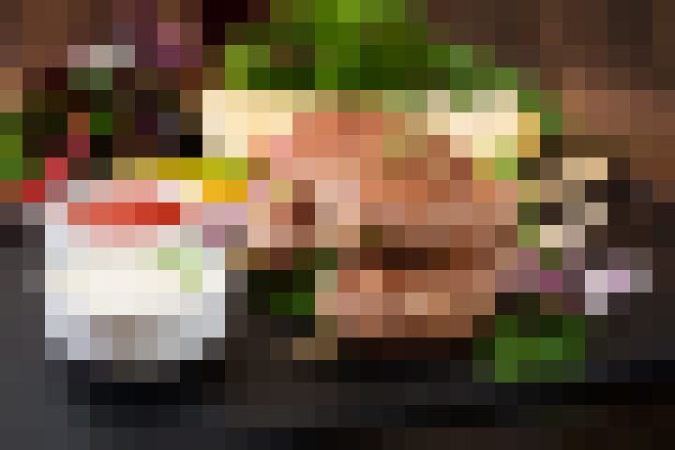 Heavily pixelated portrait of a person; facial features and surroundings are not discernible.