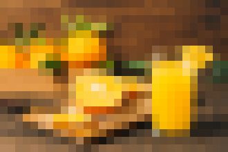 Pixelated image of two yellow bottles and a glass on a wooden table in warm light.