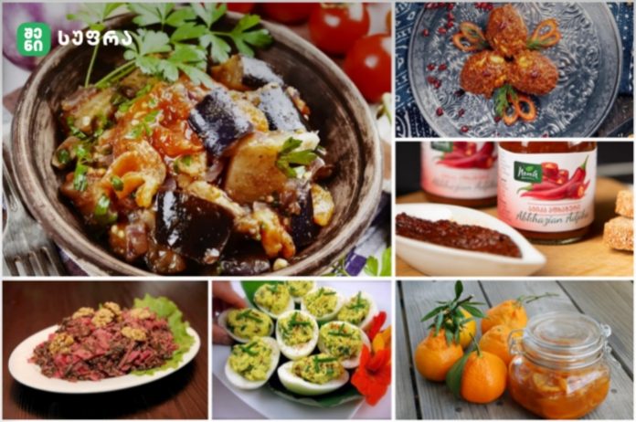 Collage of Georgian dishes: eggplant stew in a clay bowl, fried savory pastries, jars of tomato jam, beet salad, deviled eggs, stuffed eggs, and orange marmalade with oranges.
