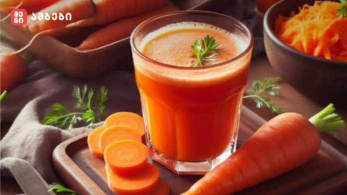 Glass of fresh carrot juice on a wooden board with sliced carrots and a whole carrot nearby, garnished with a herb sprig.