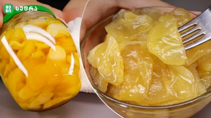 Jar of sliced peaches in syrup next to a glass bowl of chunky yellow peach slices being forked.