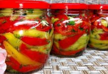 Ბულგარული წიწაკა ზამთრისთვის Three glass jars filled with red and yellow pickled peppers and herbs on a woven surface, red lids on top