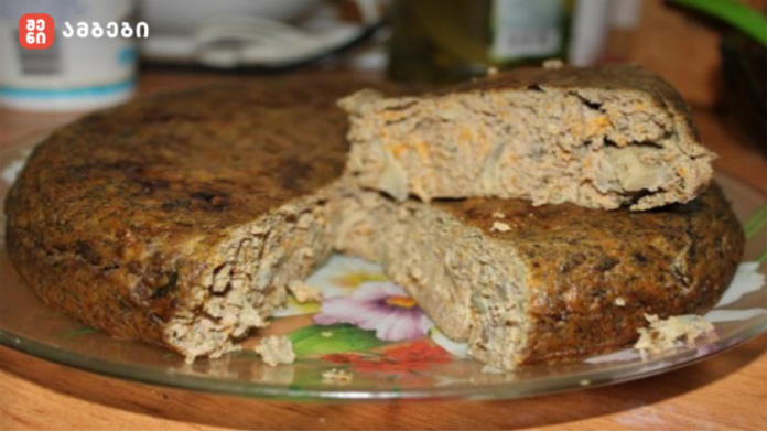 Dense, home-baked loaf cake sliced open to show its crumbly interior on a floral plate.