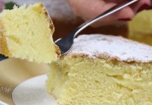 Ნამცხვარი ,,12 კოვზი” A light yellow sponge cake on a plate, a fork lifting a bite dusted with powdered sugar.
